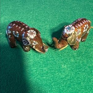 Two elephant figurines made using the Cloisonné technique.